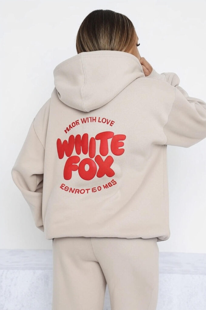 a girl wear a white fox hoddie