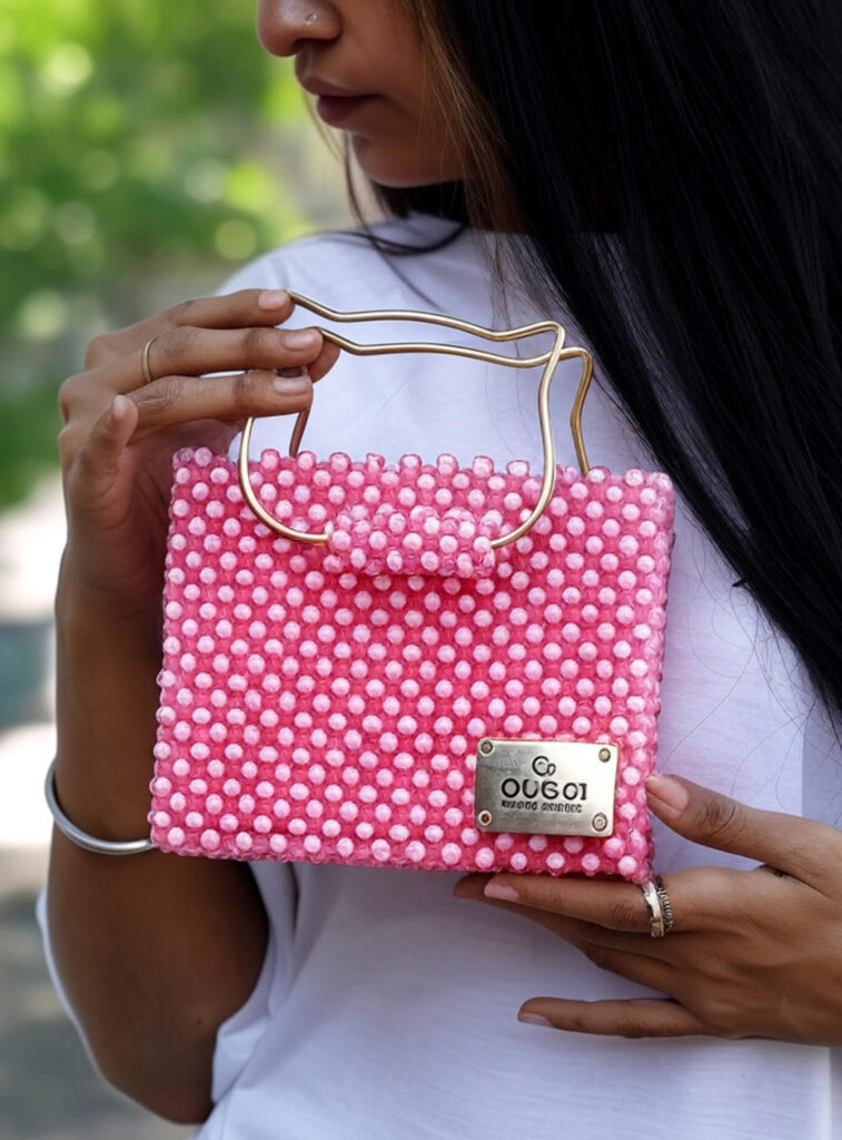 a girl carry a beaded bag